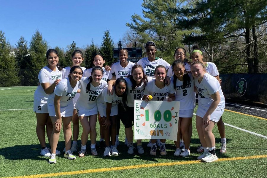 Varsity Lacrosse celebrated Emily's 100th goal at home game.