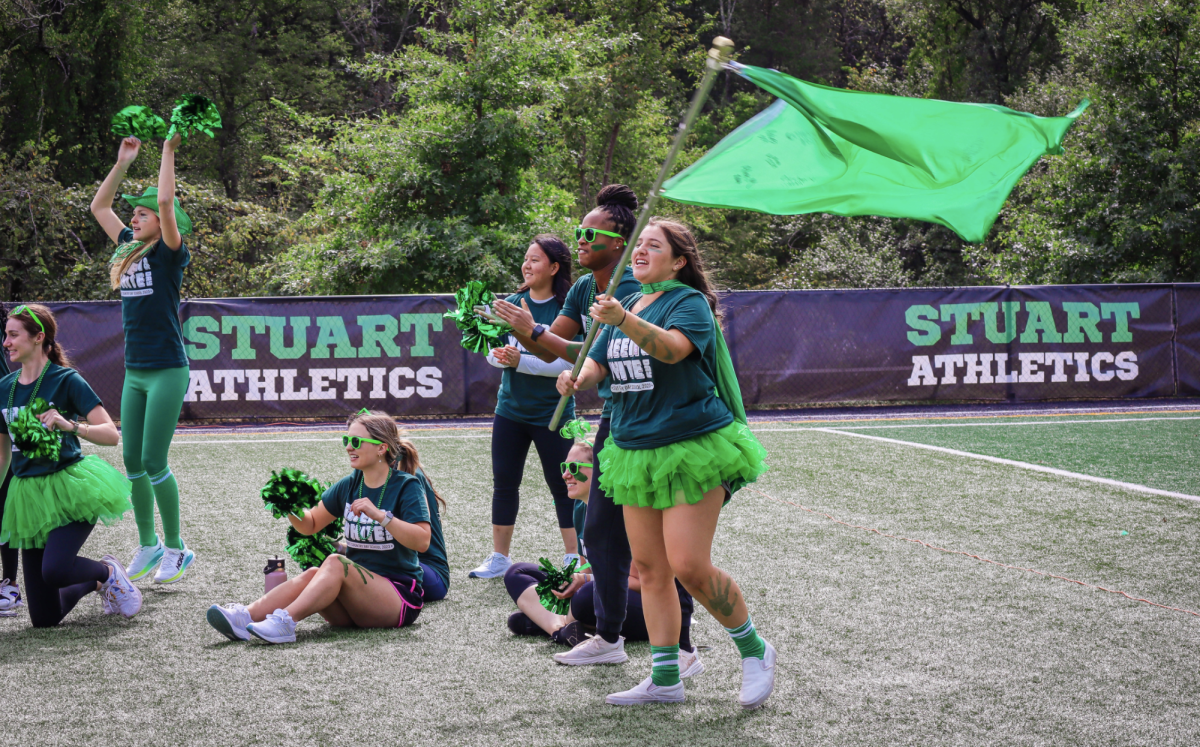 Stuart Seniors help green team win annual Green and White day.